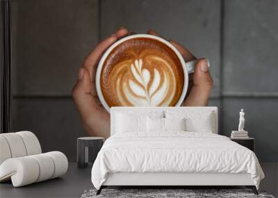 cup of coffee in hand Wall mural