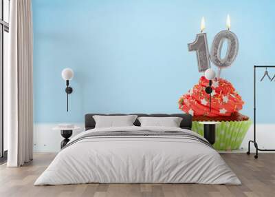 Birthday cupcake with burning candles Wall mural