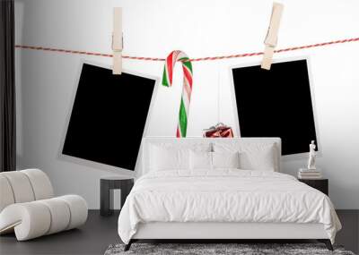 Blank photo frames and candy cane hanging on the clothesline Wall mural