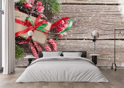 Christmas gift box, candy canes and fir tree Wall mural