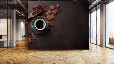 Coffee cup and chocolate on old kitchen table Wall mural