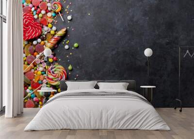 Colorful candies, jelly and marmalade over stone Wall mural