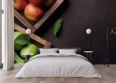 Green and red apples in wooden box Wall mural