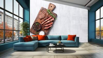 Grilled beef steak with spices on cutting board Wall mural