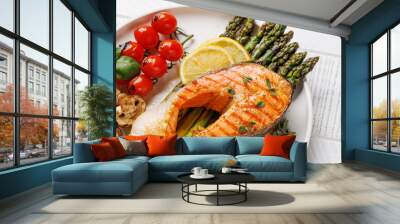 Grilled salmon steak over grilled asparagus, a delicious meal Wall mural