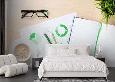 Office workplace with charts, plant and notepad Wall mural