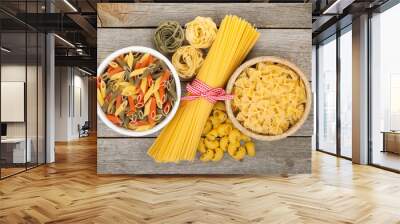 Pasta on wooden table Wall mural