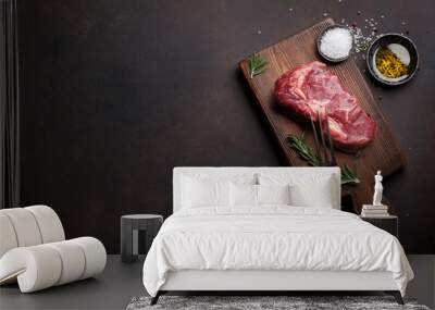 Raw ribeye beef steak cooking with ingredients Wall mural