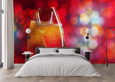 Two champagne glasses over christmas background Wall mural