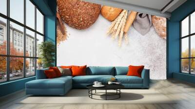 Various bread with wheat and cooking utensils Wall mural