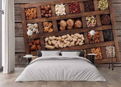 Various nuts in wooden box Wall mural