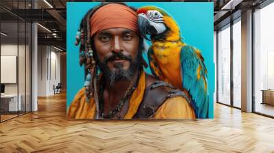 A striking portrait of a man with dreadlocks and a vibrant headband, accompanied by a colorful parrot perched on his shoulder, set against a bold bold background. Wall mural