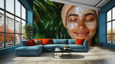 Beautiful young woman is enjoying a cosmetic treatment with her eyes closed Wall mural