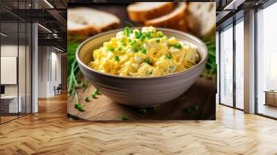 Egg salad with chopped green onions on top in a bowl. Wall mural