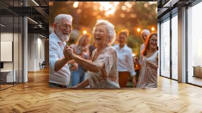 Senior couple dancing at an outdoor party Wall mural