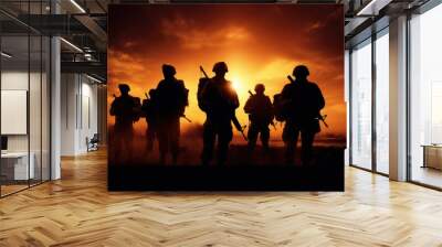 The military silhouettes of soldiers hold gun against with sunset sky background. Wall mural