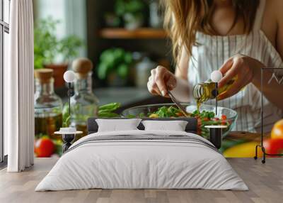 Woman pouring olive oil in to the vegetable salad, healthy eating. Wall mural