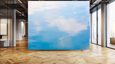 Blue sky and white cloud reflect on the water in a bright day look like impressionist painting, Water reflection abstract background concept Wall mural