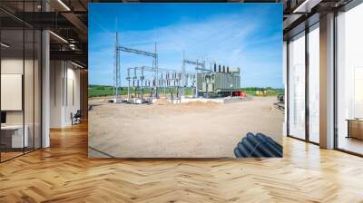 a new power substation is built on a field Wall mural