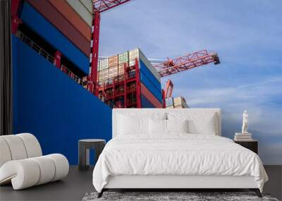 on blue container ship there are many stacked industrial containers Wall mural