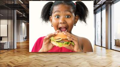 Hungry little african girl about to eat hamburger. Wall mural