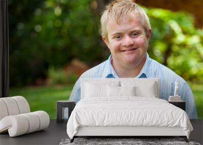 Smiling handicapped boy outdoors. Wall mural