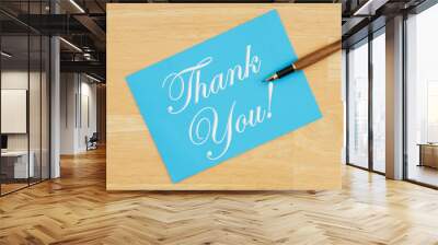 Thank you blue greeting card with a pen on textured wood Wall mural