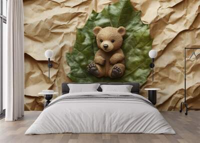 Baby bear on green leaf Wall mural