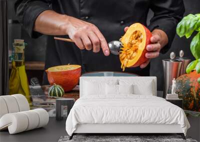 Chef cutting fresh and delicious pumkin and vegetables for cooking soup Wall mural