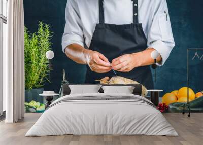 Chef preparing stuffed duck Wall mural