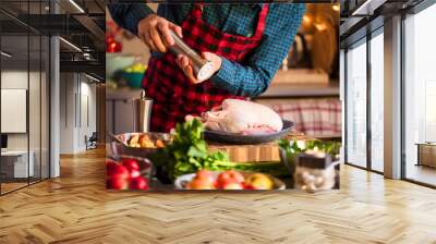 Man preparing delicious and healthy food in the home kitchen for christmas (Christmas Duck or Goose) Wall mural