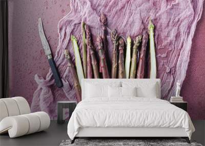 purple Asparagus as close-up on an old concret board with copy space  Wall mural