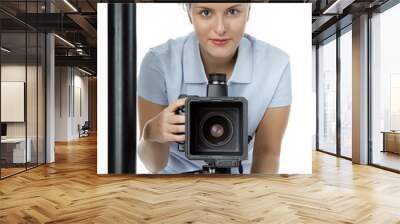 Pretty young photographer with her camera  at a photo shoot Wall mural