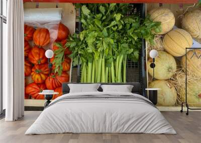 Fresh vegetables greens and fruits on the market. Parsley, tomatoes and melon Wall mural