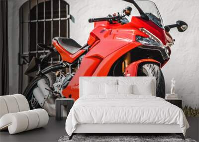 red motorcycle parked on a street Wall mural