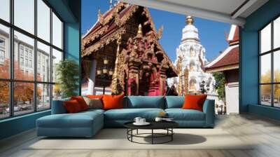 Chiang Rai Thailand, white chedi and ornate pagoda in the grounds of Wat Klang Wiang  Wall mural