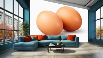 Two Brown Eggs Sitting Next to Each Other Wall mural