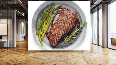 Cooked Beef steak on grey plate with asparagus and rosemary on white background Wall mural