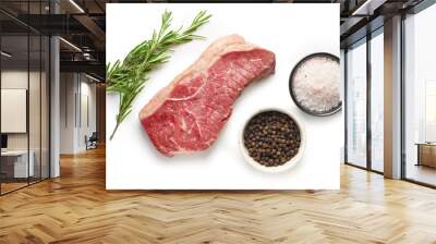 raw beef steak with rosemary and spices isolated on white background top view Wall mural