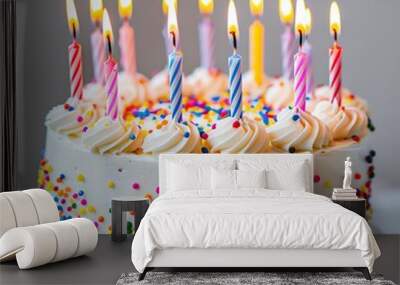 Festive birthday cake with candles, white background, closeup shot, colorful and celebratory Wall mural