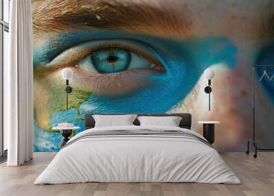 Close-up of a young man's eyes with painted on his face. Wall mural