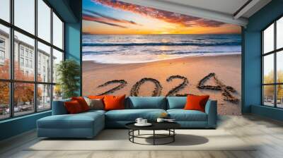 New year, 2024 written in sand on a beach during soft sunset. Wall mural