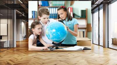 Pupils find something at the school globe Wall mural