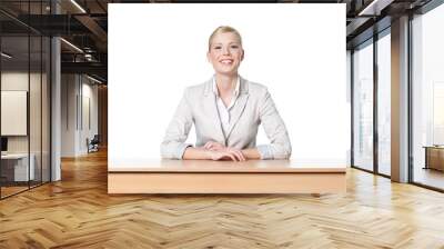 Young business woman sitting at a desk, isolated Wall mural