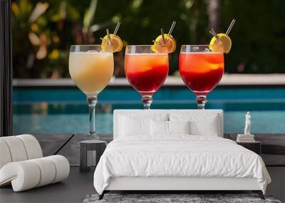 Close-up shot of glasses of cocktails on poolside Wall mural