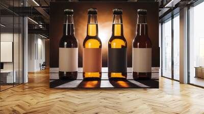 Low angle view of two glass bottles with beer and blank labels in row on dark background with back light Wall mural