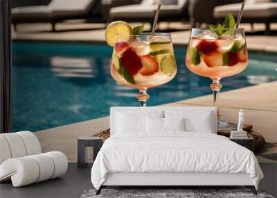 Two glasses with natural, delicious refreshing beverage at poolside Wall mural