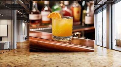 Yellow Cocktail with orange on the wooden Bar Wall mural