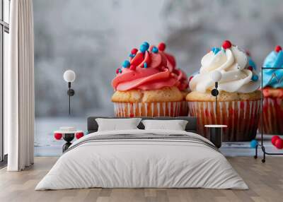 Four cupcakes decorated with red white and blue frosting celebrating an american holiday Wall mural