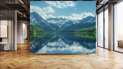 A Mountain Lake Reflecting a Dramatic Mountain Range and a Cloudy Sky Wall mural